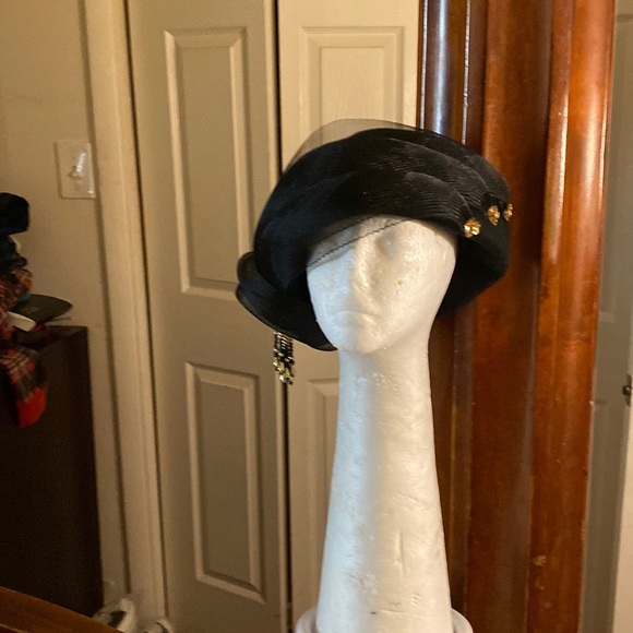 Bkack hat with gold embellishments veil front